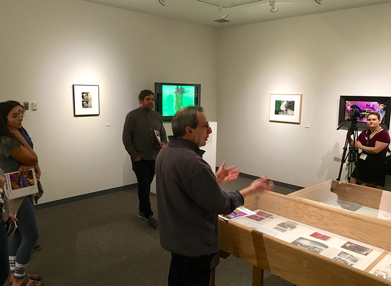 men looking at exhibits