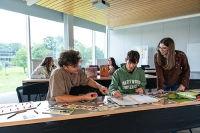 three students in education classroom What Are the Requirements to Be a Teacher? Your Path Starts at Marywood University