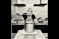 Keynote presenter Tannis Kowalchuk is picture over a large stockpot with a wooden spoon in her hand. Advocacy/Social Justice Day Focuses on Food Justice and Nourishing Community