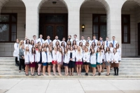 Physician Assistant students accept their first white coat.