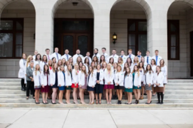 Physician Assistant students accept their first white coat.