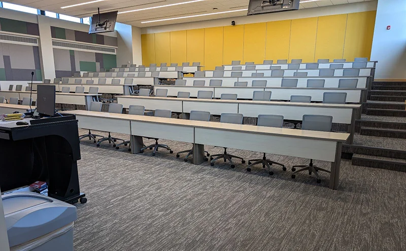 large lecture hall with rows of empty seats