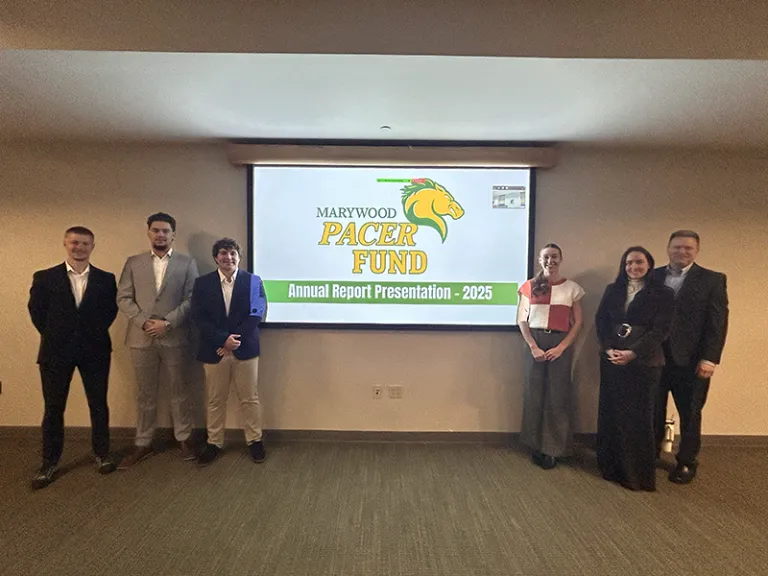 people standing in front of a screen that says pacer fund
