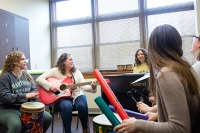 people sitting in circle playing musical instruments Healing Through Harmony: How Music Therapy at Marywood Transforms Lives