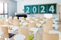 The back view of an empty classroom with 2024 written on the chalkboard. Marywood Launches a Suite of Academic Programs in 2024
