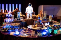 An astronaut figurine is surrounded by galaxy-themed desserts with special lighting to complete the atmosphere of the winning theme. Marywood University Captures Grand Prize /Gold Award in National Dining Contest