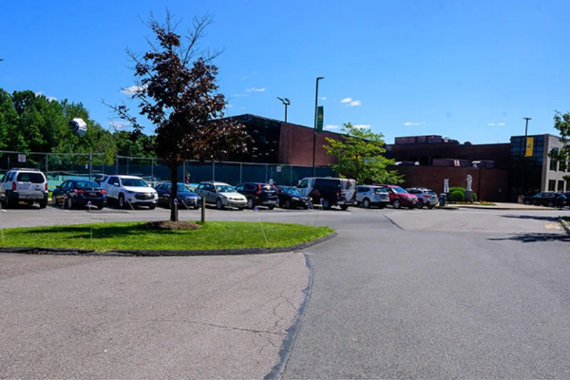 The parking lot behind the Athletic Center filled with cars