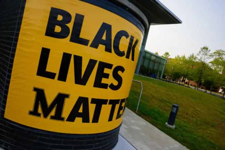 Black Lives Matter Yellow and Black Banner hung on Learning Commons Overlook