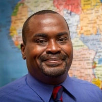 headshot with a map behind it Dr. Yerodin Lucas Keynotes Annual MLK Community Celebration