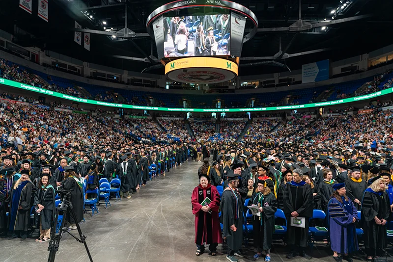 arena full of people in academic attire Marywood University Celebrates 108th Annual Commencement Ceremony