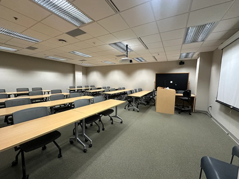 An L-shaped desk with chairs in the Marywood healthy families classroom