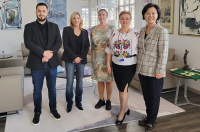 A group of visiting faculty from Romania joined President Lisa Lori in her office, along with Sister Angela Kim, IHM.