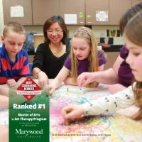 professor with four children coloring on large paper with crayons