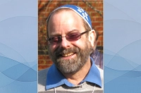 A photo of Rabbi Swartz is situated on a blue background Rabbi Daniel Swartz to Present a Dialogue about Vocation