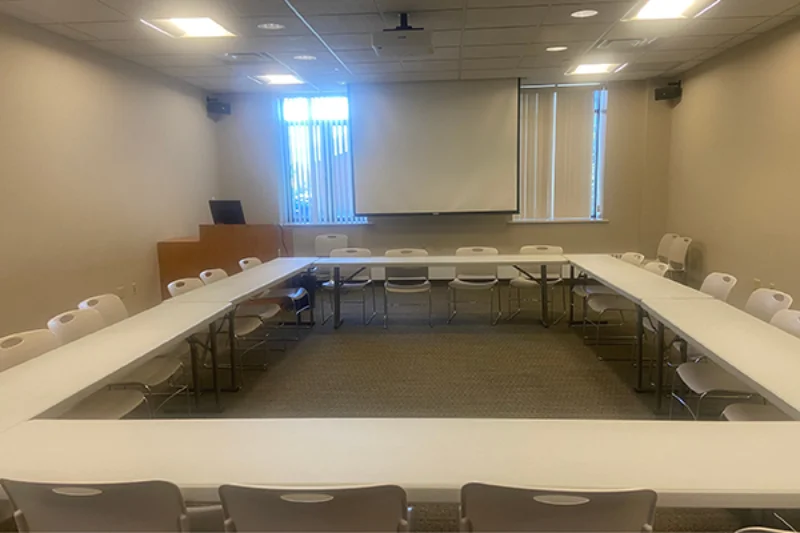 A square-shaped table lined with chairs in the Marywood conference center