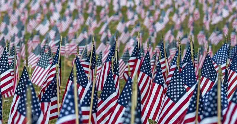 An American flag is pictured in the background of Marywood's and the Pennsylvania National Guard's logos Marywood to Provide 100% Tuition Coverage for Eligible PA National Guard Students and Families