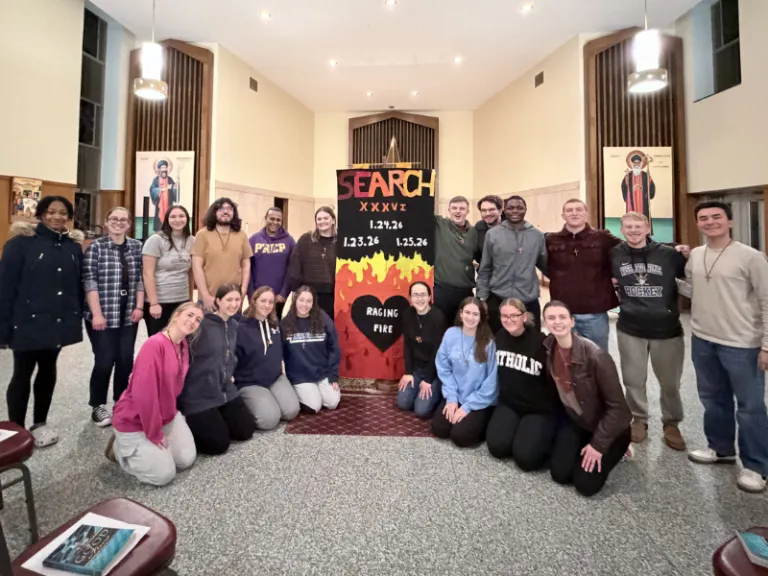 students gathered by search retreat poster