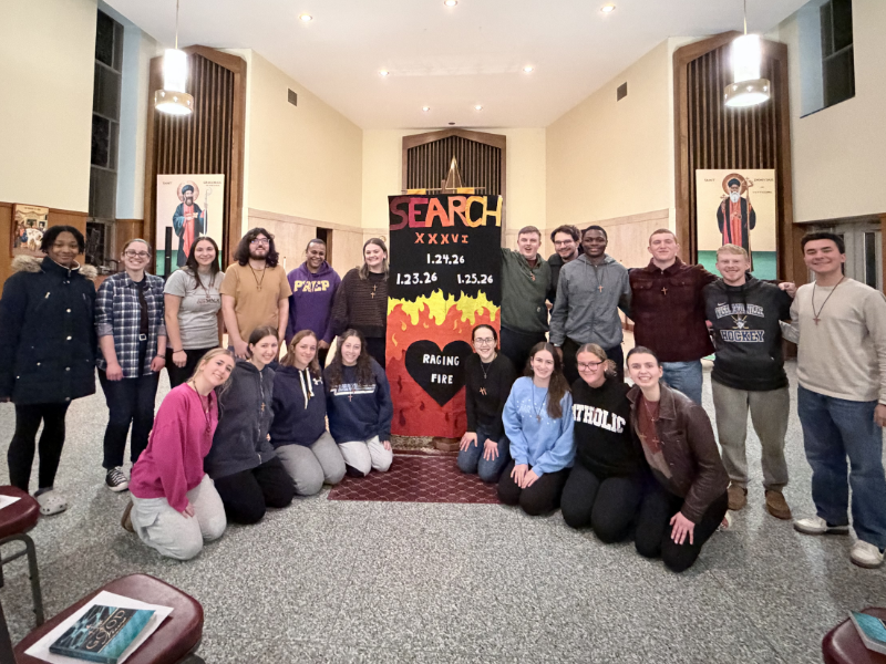 students gathered by search retreat poster