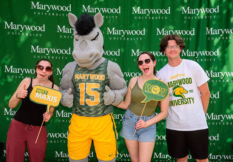 students with horse mascot in front of marywood backdrop