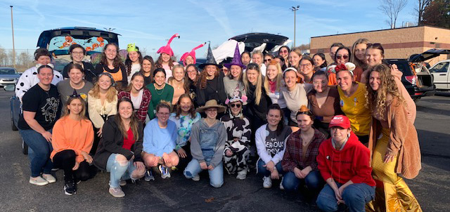 Many Marywood students in costumes at a Trunk or Treat